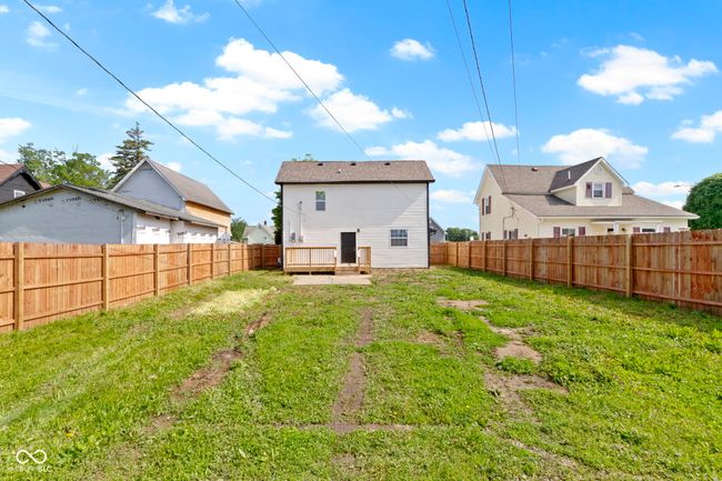back of house featuring a wooden deck | Image 38