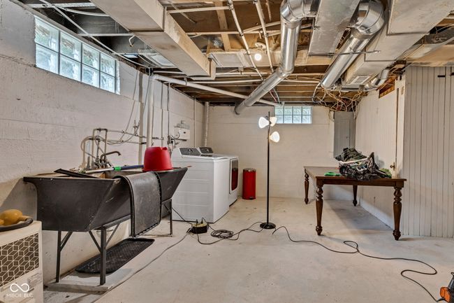 Below grade area featuring washer and clothes dryer. | Image 45