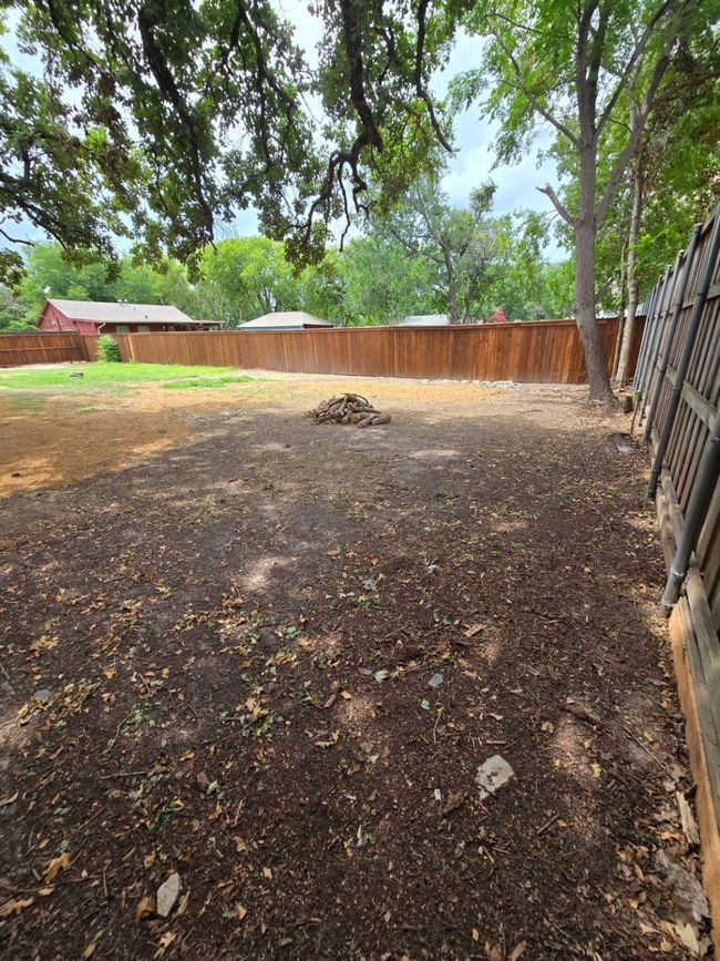 View of fenced backyard | Image 6