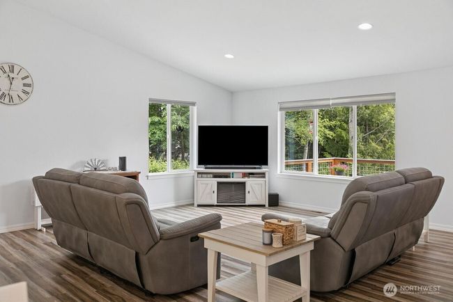 High ceilings and front windows bring in an abundance of sunlight. | Image 4