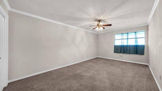 Bedroom 2 featuring ceiling fan, carpet floors, and crown molding | Image 22