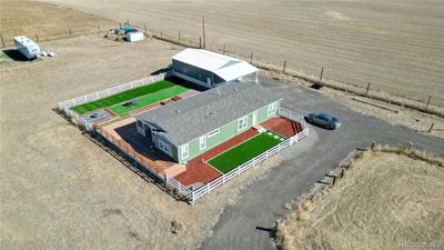 Ranch modular home with fenced yard and detached garage | Image 1