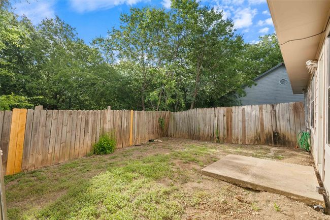 Enjoy your own slice of South Austin outdoors in this private, fenced-in backyard with mature trees and room to relax, garden, or play. | Image 14