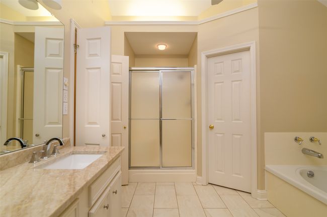 Full bath with vanity, a shower stall, and a garden tub | Image 13