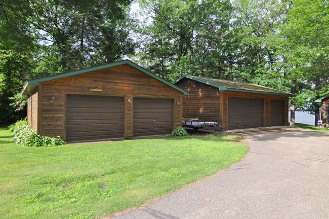 2 car garage plus a heated & insulated, 3 car garage and paved driveway. | Image 4