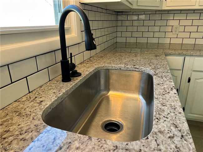 Details with a sink and decorative backsplash | Image 6