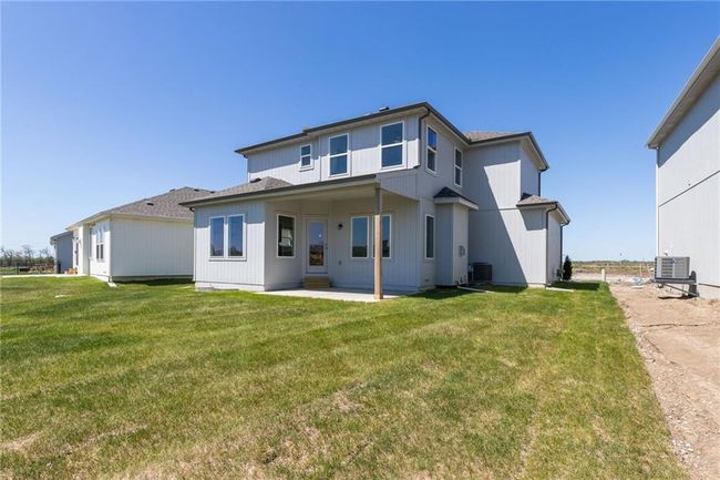 NOT ACTUAL HOME: Back of home with covered patio (upgrade) | Image 35