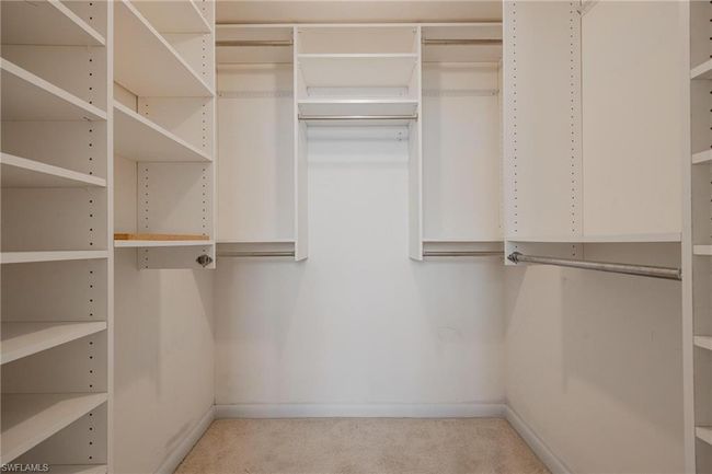 Walk in closet with light carpet | Image 20