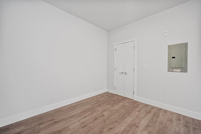 Empty room featuring electric panel and wood finished floors | Image 21