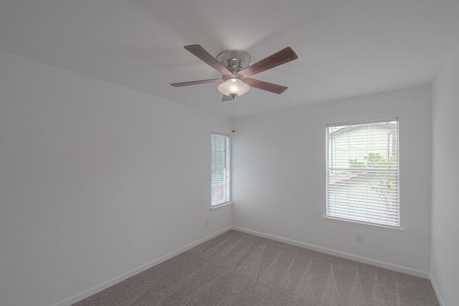 The first of three bedrooms. | Image 17