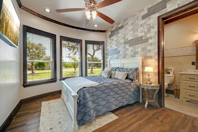Bedroom featuring dark wood finished floors, a ceiling fan, ornamental molding, recessed lighting, and baseboards | Image 27