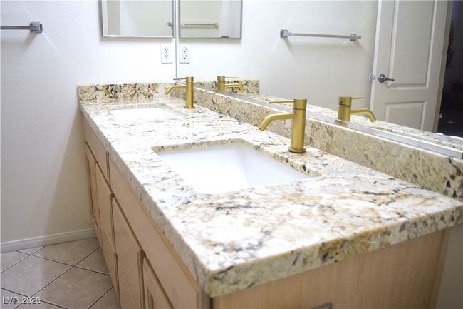 Bathroom featuring double vanity and tile patterned flooring | Image 35