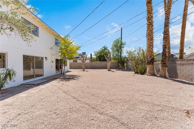 View of fenced backyard | Image 52