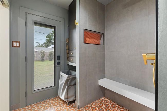 The primary bath also features a secure door to the back yard which offers a great option for outdoor entertaining. | Image 11