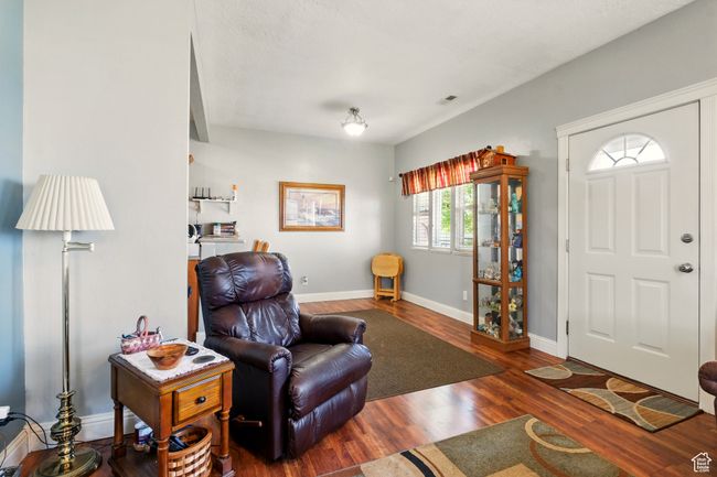 Living room featuring wood finished floors and baseboards | Image 10