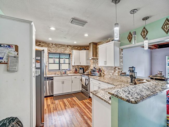 2160 Ne Coachman Rd, House other with 3 bedrooms, 2 bathrooms and null parking in Clearwater FL | Image 8