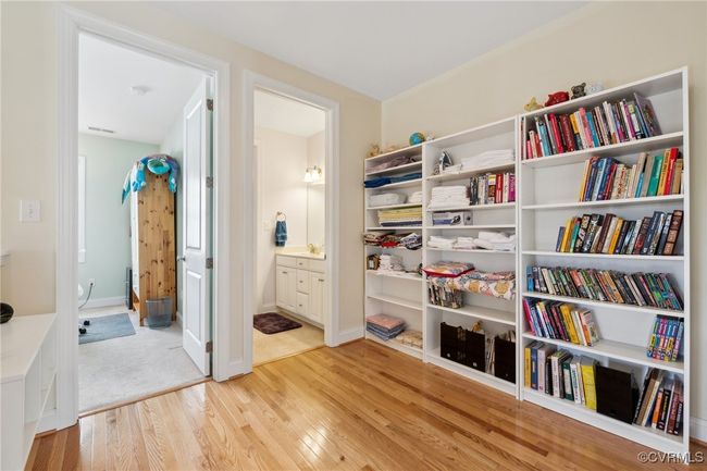 2nd floor loft which could serve as a flex space for a reading nook, homework area, etc. Door to the left leads to the first secondary bedroom, and 2nd floor full bath through door to the right. 8' doors are found on the 2nd floor as well. | Image 34
