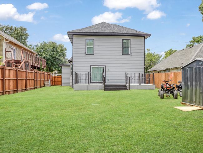 Rear view of house with roof with shingles | Image 29