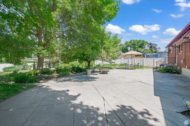 View of patio featuring a fire pit | Image 31
