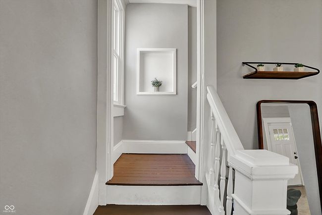 stairway with baseboards | Image 25