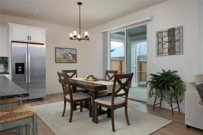 Large dining area, sliders to the patio and backyard. | Image 5