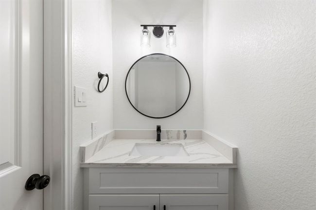 Powder bath located on first floor offers convenience for guests. | Image 12