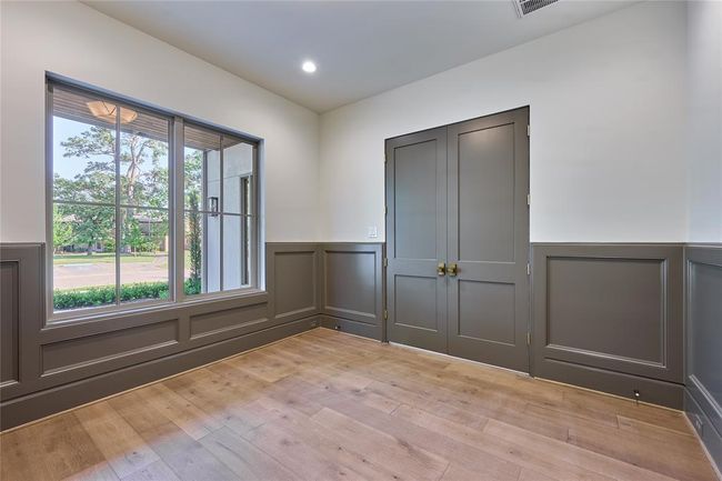This room features elegant wood paneling.Ideal for a home office/study. | Image 6