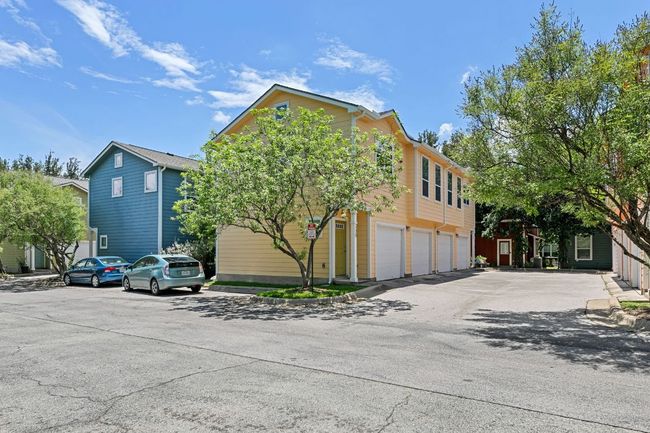View of front of property featuring an attached garage and asphalt driveway | Image 8
