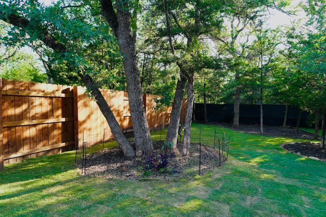 View of fenced backyard | Image 30