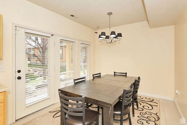 Dining area featuring a notable chandelier and baseboards | Image 15