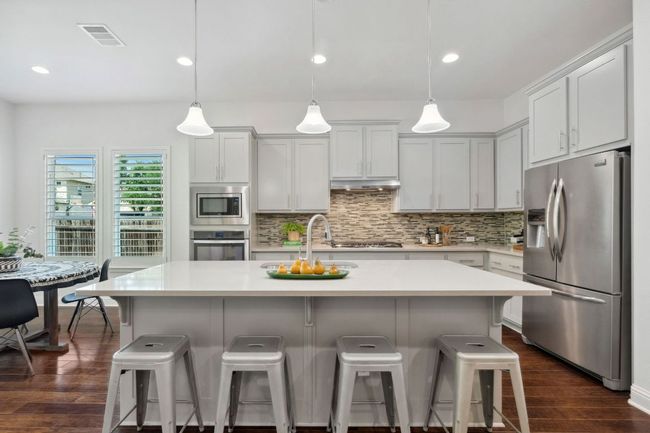 The island creates a great casual dining space, serving area, or a place to connect with guests while cooking. | Image 14