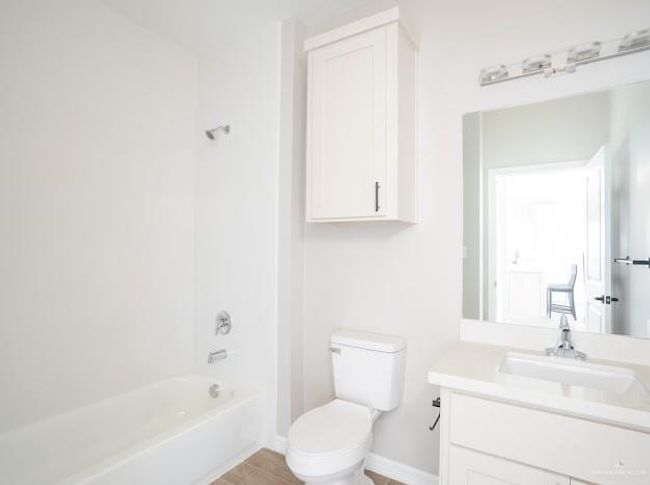 Full bathroom featuring vanity, shower combination, tile patterned floors, and toilet | Image 9