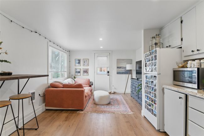 Living area with recessed lighting, light wood finished floors, and baseboards | Image 28