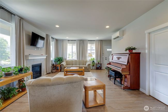 To the left you can see the small entryway. This leads to the garage and closet on your left and the primary bedroom on the right | Image 17