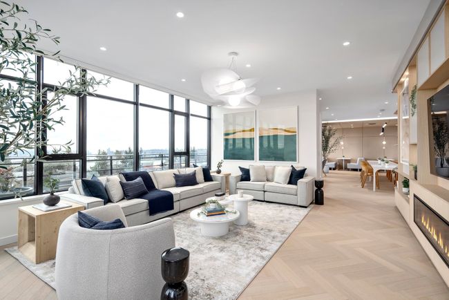 Living area with healthy amount of natural light, a chandelier, floor to ceiling windows, and recessed lighting | Image 7