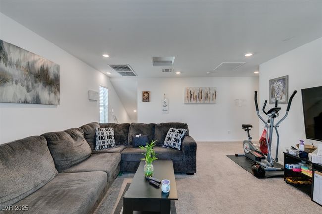 Living area with visible vents, recessed lighting, and carpet flooring | Image 37