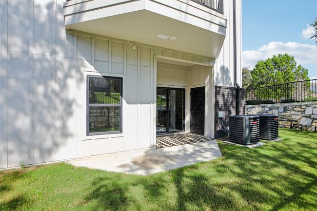 Doorway to property featuring a patio area and board and batten siding | Image 29