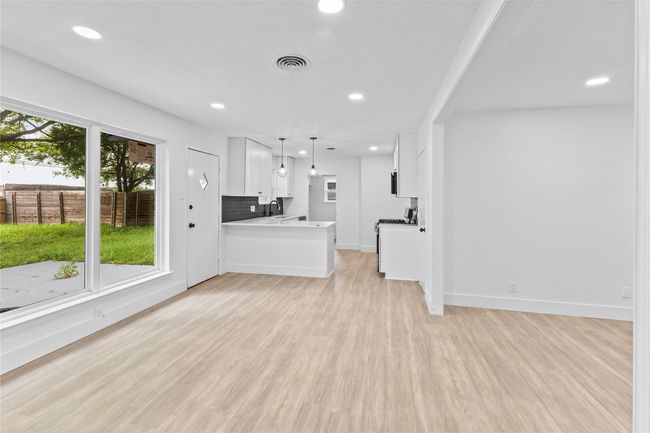 Unfurnished living room with recessed lighting, light wood finished floors, a sink, and baseboards | Image 19