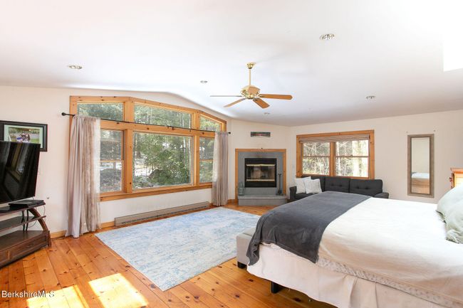 Primary suite with fireplace, walk-in closet and large en suite bath | Image 10