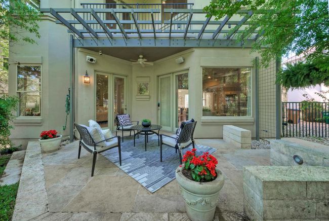 View of patio / terrace with a pergola, ceiling fan, and fencing | Image 31