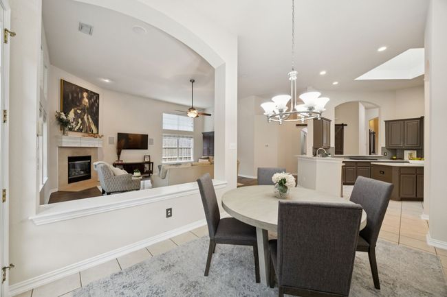 Open sightlines from the breakfast room connect seamlessly with both the kitchen and living room, enhancing everyday function with style and natural light. | Image 15