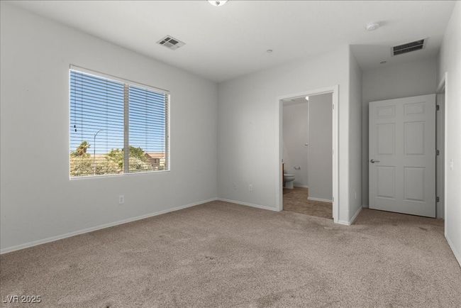 Unfurnished bedroom featuring carpet and ensuite bath | Image 23