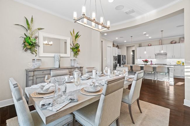 Just off the kitchen, the dining area offers the perfect setting for family meals and celebrations. | Image 9
