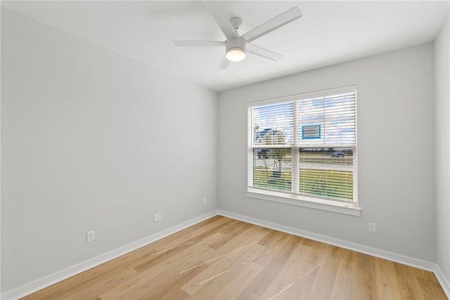 Unfurnished room with light hardwood / wood-style flooring and ceiling fan | Image 23