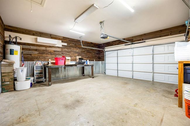 This two car garage is AIR-CONDTIONED with a mini split so that you can work in comfort on these hot summer days. | Image 30