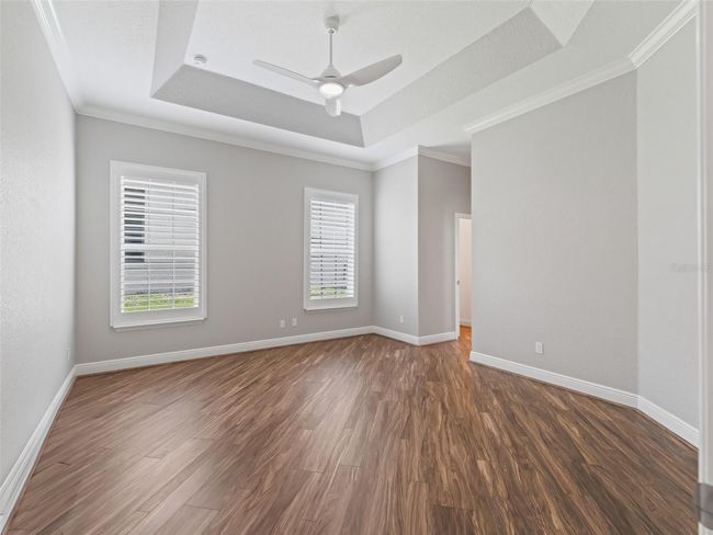 Primary suite w/Golf & Water View w/Plantation Shutters | Image 37