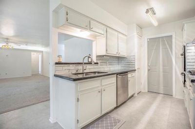 Gorgeous kitchen renovated in 2020. Granite countertops, mirror-edge tile backsplash, new sink and new disposal. | Image 1