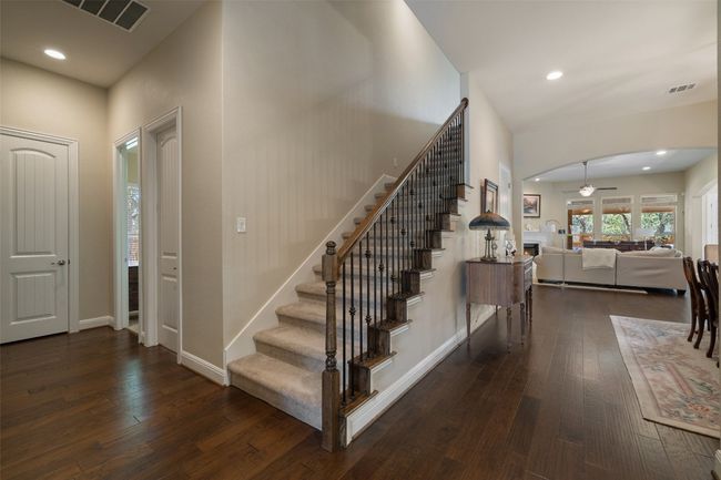 Staircase leads to a flexible second living area — easily convertible into a 4th bedroom and full bathroom, depending on your needs. | Image 21