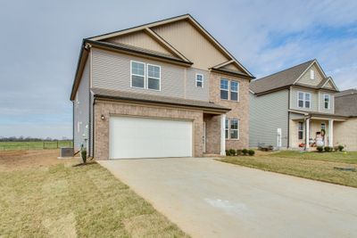 Photo is of similar home, same floor plan. | Image 1