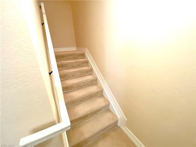 Staircase with carpet floors and baseboards | Image 7